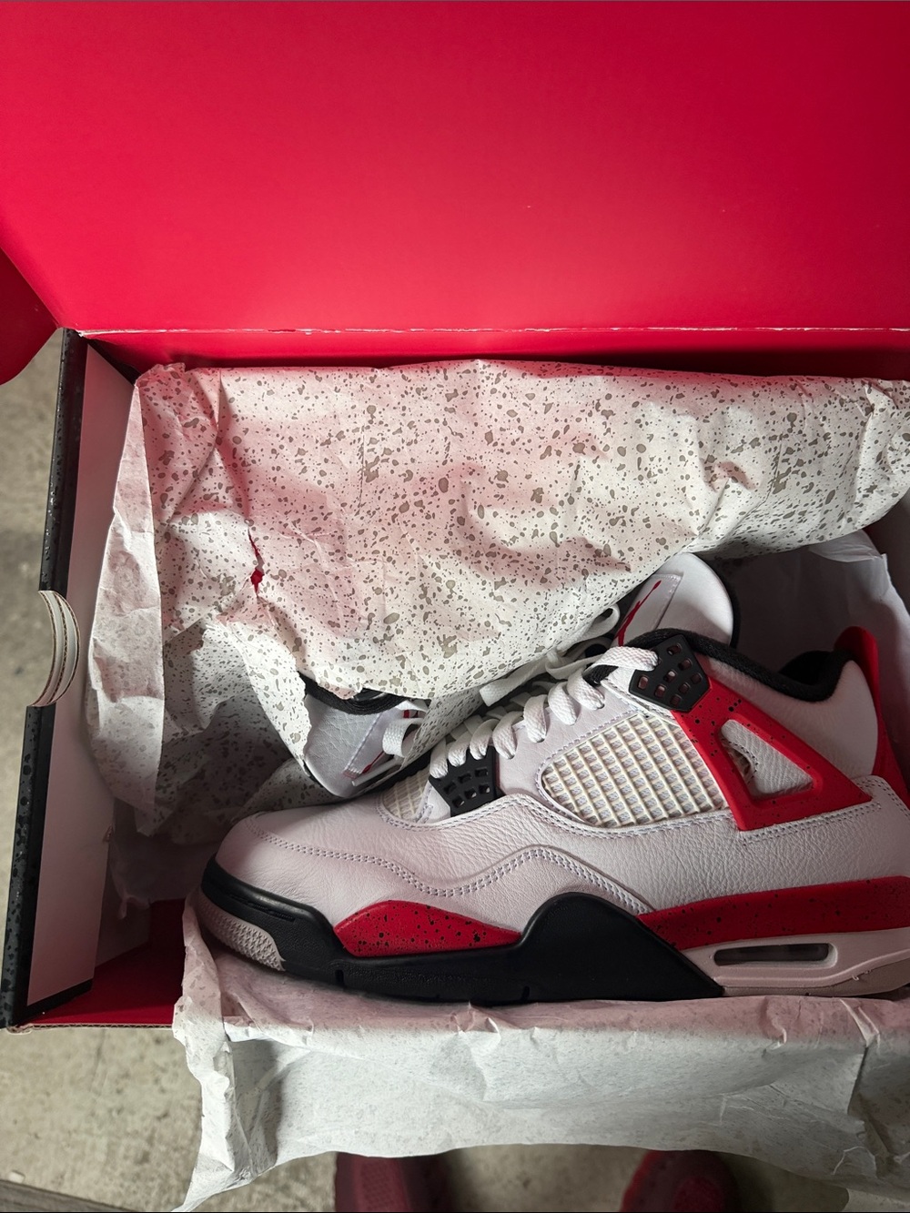 Men’s size 9.5 Jordan 4 Retro White and Red Athletic Shoes